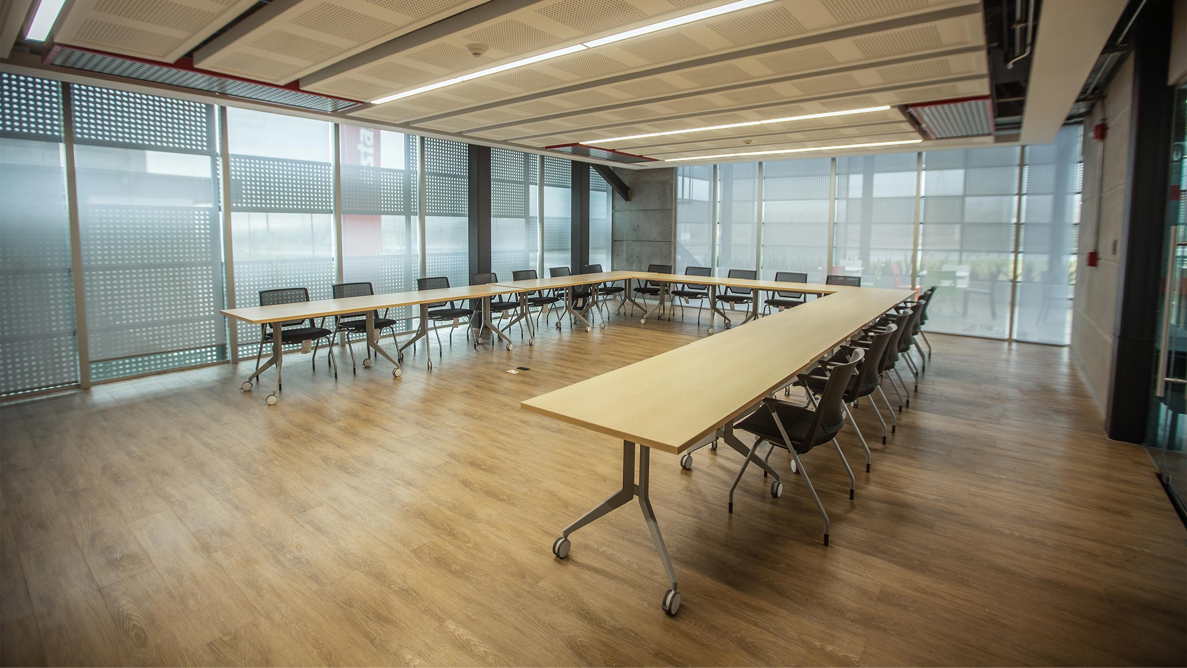 Interior photograph of a custom made office building meeting room with state of the art office furniture